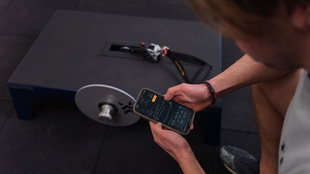 Man looking at progress in Exxentric App