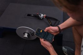 Man looking at progress in Exxentric App