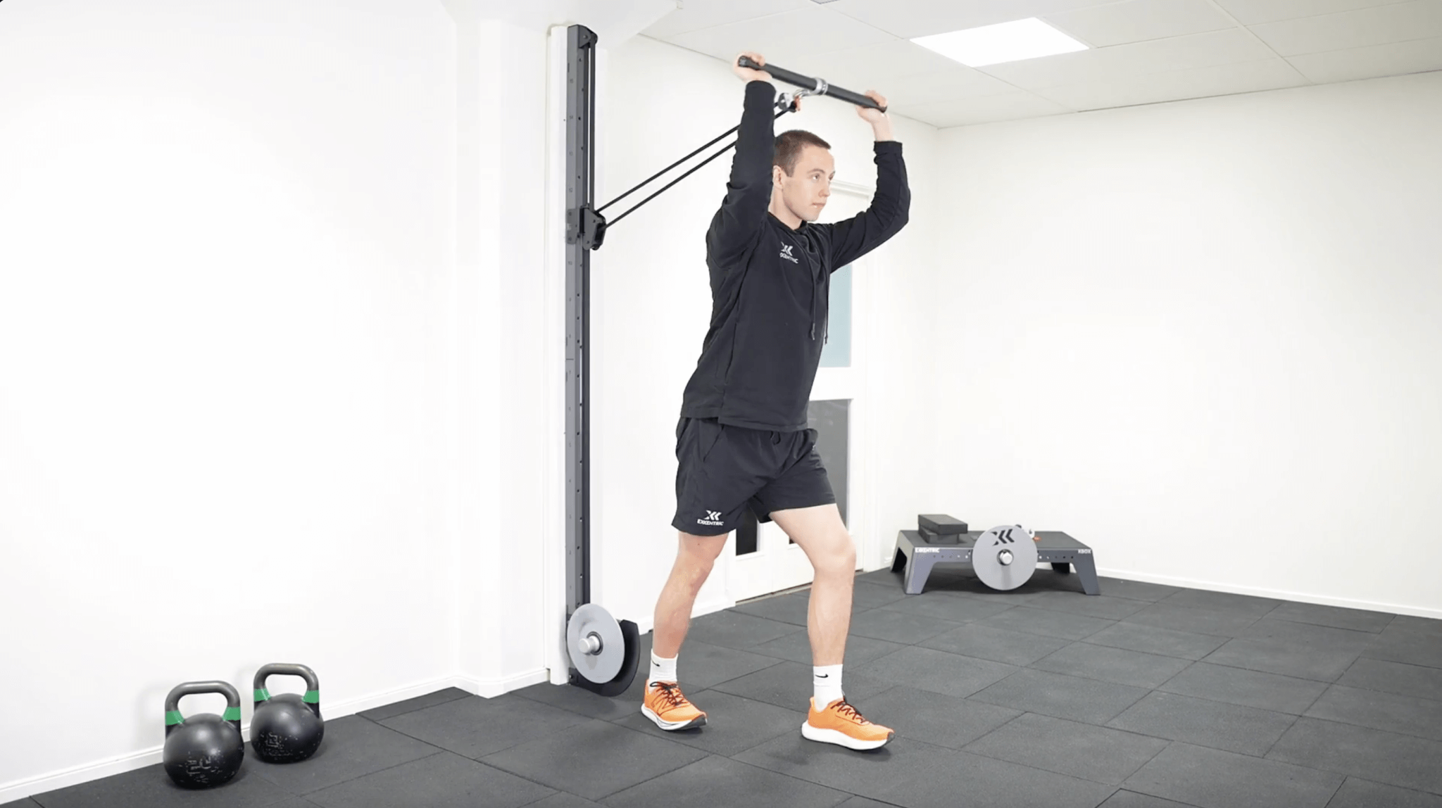 Standing kPulley tricep extension with kBar