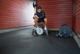 Squat on a kBox in a garage gym
