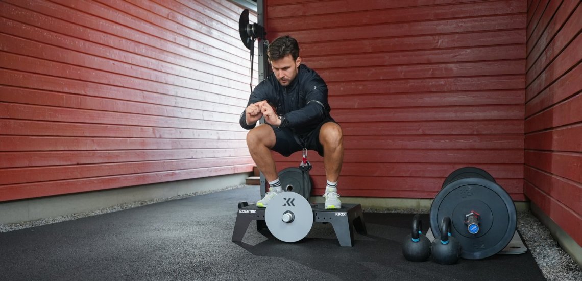 Squat on a kBox in a garage gym