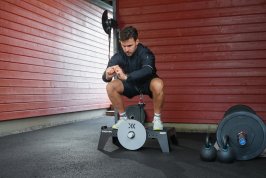 Squat on a kBox in a garage gym