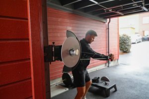 kPulley Go Standing Core Twist in a garage gym