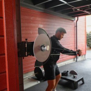 kPulley Go Standing Core Twist in a garage gym