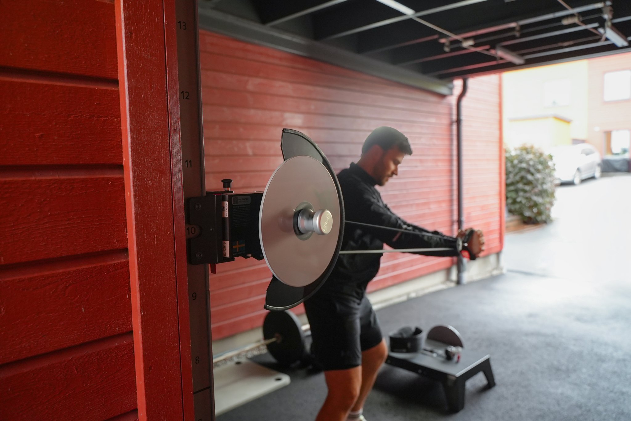 kPulley Go Standing Core Twist in a garage gym