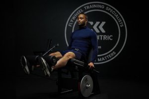 Man doing leg extensions on LegExx