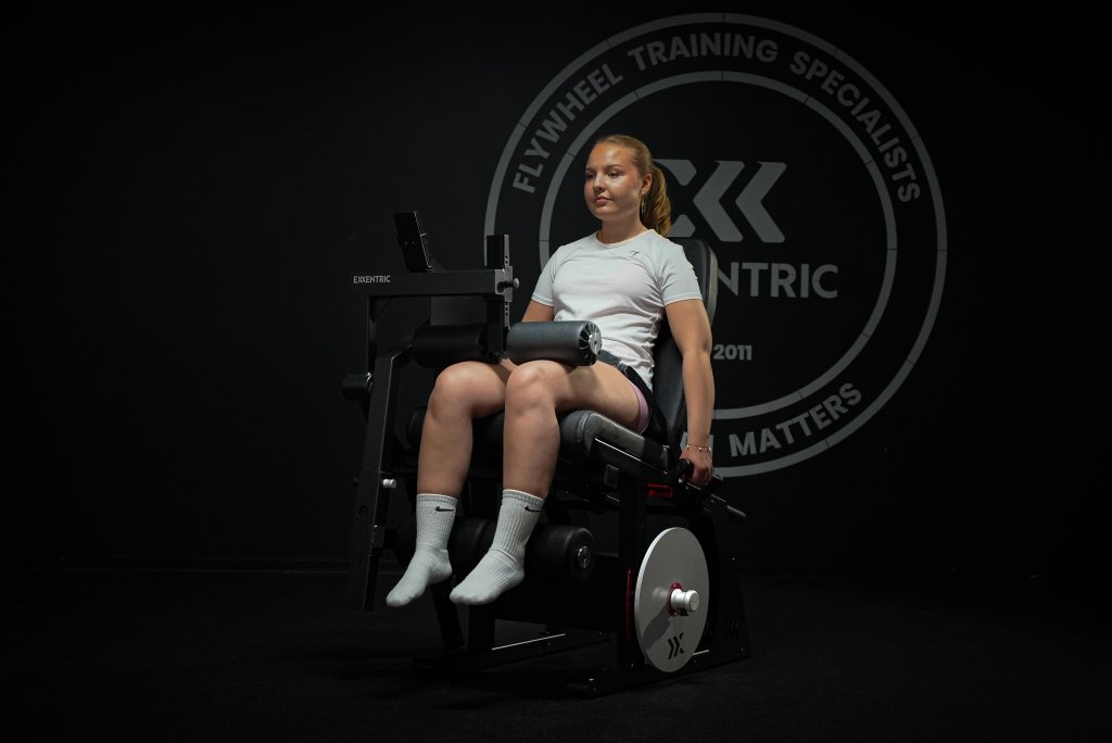 Woman doing leg curls on LegFlexx