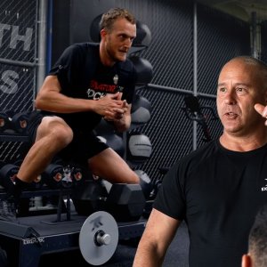 Fredrik leading a lecture with a lateral squat performed in the background