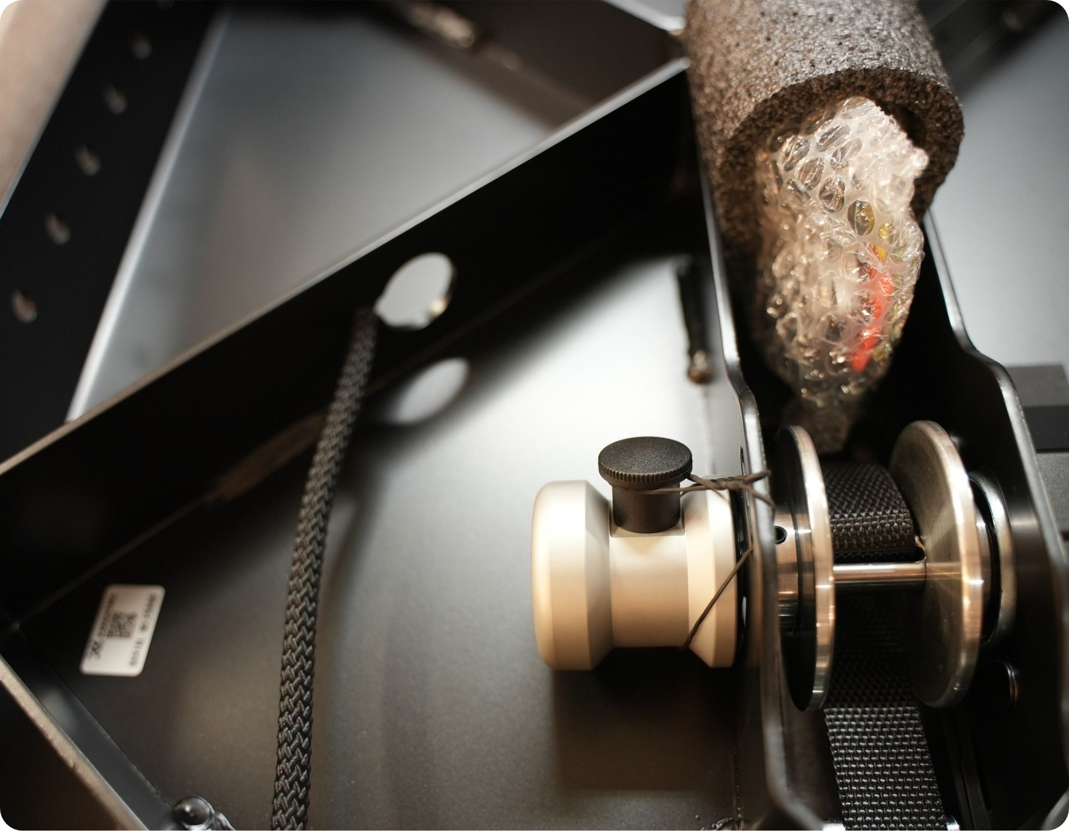 Flywheel knob is packed on the underside of the kBox